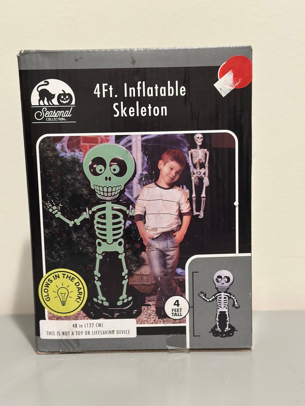 Seasonal Collection 4Ft Inflatable Skeleton Glow in the Halloween Yard Decor